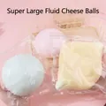 Detail view of colorful oversized slow rebound squishy toys in clear packaging - Fluid Daifuku Cheese Ball / 10cm / Blue