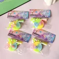 Detailed close-up of colorful rainbow lollipop squishy stress relief toys in retail packaging - Rainbow Lollipop Squishy