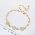 Elegant 18K gold plated link bracelet featuring micro-pave heart charms and crystals - Style 7 (Model 7)