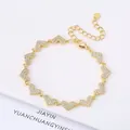 Gold-plated bracelet featuring sparkling heart charms encrusted with small crystals - Style 17 (Model 17)