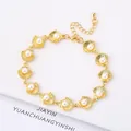 Elegant gold-plated shell bracelet featuring white pearls and an adjustable link chain - Style 20 (Model 20)
