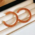 Exquisite amber resin hoop earrings in a jewelry box, elegant Maillard style accessories. - Amber Tortoise Hoops (27#)