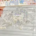 Giocattolo squishy croissant trasparente con perle e stelle, fiocco decorativo - Cornetto