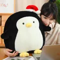 Cuddly large plush penguin toy with a red Santa hat perfect for Christmas gifting - 50cm / Black
