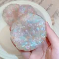 Close-up view of a translucent iridescent bursting bead squishy toy for creative stress relief - Large Colorful Popping Beads