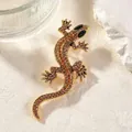 Élégante broche lézard vintage dorée ornée de strass étincelants dans les tons orange - Marron