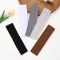 Five multi-color elastic sports headbands arranged on a wooden tray with a tulip. - Thin Style (Style 2) / 5 Pieces / Classic Colors Combination