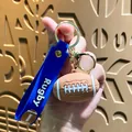 Rugby ball keychain with blue silicone strap and gold metal ring souvenir - Rugby Ball