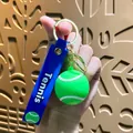 Mini tennis ball keychain with blue silicone strap and gold keyring - Tennis Ball