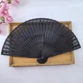 Elegant black wooden folding fan with delicate hollow-out floral patterns - Black Hollow