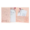Close-up view of an elegant peach laser-cut wedding invitation card with floral details - Light Pink 250G