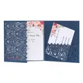 Detailed view of the navy blue laser-cut wedding invitation featuring floral inner cards - Magic Blue