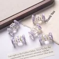 Close-up of cute hand-painted candy shaped acrylic beads for DIY bracelets and crafts - Price per Piece / Purple + White