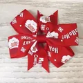 Festive red Christmas bow hair clip featuring Santa Claus print and Merry Christmas text - Red Santa Snowflake Style(18)