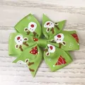 Festive green Christmas hair bow for girls with cute reindeer and tree prints on ribbon - Green Reindeer Head Print Style(19)