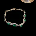 Elegant vintage gold-plated bracelet with emerald green oval zircon stones inlay - Gold/Green