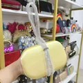 Elegant yellow satin evening clutch bag featuring a sparkling rhinestone wristlet strap - 19cm x 6cm x 12cm / Bright Yellow