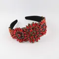 Close-up of a wide Baroque headband featuring intricate red rhinestone flower patterns. - Luxury Red (C)
