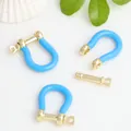 Detail view of blue enamel copper U-shaped horseshoe buckles for DIY jewelry making - Sky Blue