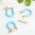 Detail view of blue enamel gold-plated copper U-shape horseshoe buckle for DIY jewelry - Light Blue