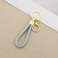 Elegant silver braided cord keychain with polished gold hardware for car and home use - Generation 1 Round Dragon Woven Buckle (Light Gold) / Silver