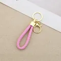 Elegant pink braided leather keychain with gold ring and clasp for car keys and bags - Generation 1 Round Dragon Woven Buckle (Light Gold) / Pink
