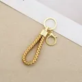Elegant golden braided rope car keychain with handmade leather design in gold finish - Generation 1 Round Dragon Woven Buckle (Light Gold) / Gold