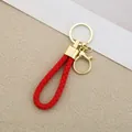 Red braided leather rope keychain with gold-toned lobster clasp and metal ring - Generation 1 Round Dragon Woven Buckle (Light Gold) / Red