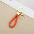Vibrant orange braided leather cord keychain featuring a gold-finish ring and lobster clasp - Generation 1 Round Dragon Woven Buckle (Light Gold) / Orange