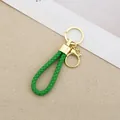 Handmade green braided leather rope keychain with gold-toned metal hardware - Generation 1 Round Dragon Woven Buckle (Light Gold) / Green