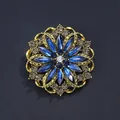Vintage floral brooch featuring elegant blue glass crystals and a textured gold-tone finish - Ink Blue & Grey Diamond with AB White & Ink Blue Acrylic Retro