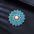 Elegant retro blue crystal flower brooch with central pearl in a vintage gold finish - Light & Lake Blue with Beige Artificial Pearl & Lake Blue Acrylic