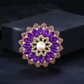Vintage gold-tone brooch featuring purple crystals and an elegant central pearl detail - Lavender & Light Purple with Beige Artificial Pearl & Light Purple Acrylic