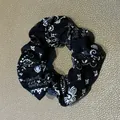 Bohemian style black fabric scrunchie with white paisley print for retro hair styling - Hair Tie Style / Black