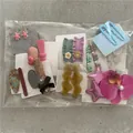 Assorted Korean style hair clips set with cute stars, flowers, and wavy designs. - Korean Fashion Hair Clips (JX-P9 10 Cards) / 10 Cards