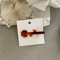 Elegant Korean style amber acetate flower hair clip mounted on a white display card - Flower Duckbill Clip (49-B4) / Coffee
