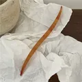Elegant amber tortoiseshell curved hairpin handmade with a minimalist acetate finish - S-Shaped Hairpin (J49-B134) / Tan