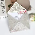 Detailed view of silver glitter laser-cut wedding invitation card with floral insert - Silver Glitter