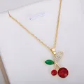 Elegant gold chain necklace featuring a cherry pendant with red and green crystals - Red Round Faceted Necklace #6 (xl2)