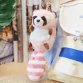 A detailed view of a cute pink and white plush raccoon keychain on a backpack bag - Round Bead Chain / Pink