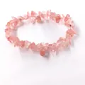 Close-up detail of a natural irregular pink rose quartz crystal chip stretch bracelet - Watermelon red