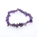 Detailed macro view of an irregular amethyst crystal gravel stretch bracelet for women - Purple Crystal
