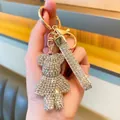 Elegant silver rhinestone bear keychain with matching glitter wrist strap for handbags - White