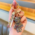 Colorful rhinestone-encrusted bear keychain with matching strap and gold-tone lobster clasp - Rainbow