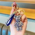 Sparkling blue rhinestone-encrusted bear keychain with a matching glittery wrist strap - Mixed Blue
