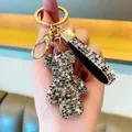 Elegant luxury rhinestone encrusted bear keychain with sparkling strap and gold hardware - Mixed Black