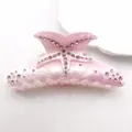 Detailed view of pink starfish rhinestone acetate hair claw clip with marble pattern. - Dreamy Pink (Pink Rhinestone)