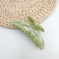 Detailed macro view of starfish hair claw clip with green marble texture and rhinestones - Seaweed Green (White Rhinestone)