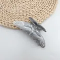 Close-up of starfish hair claw clip with rhinestones and grey marble acetate finish - Graphite Gray (White Rhinestone)