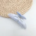 Close-up of light blue acetate starfish hair claw clip with sparkly rhinestones - Taro Purple (White Rhinestone)